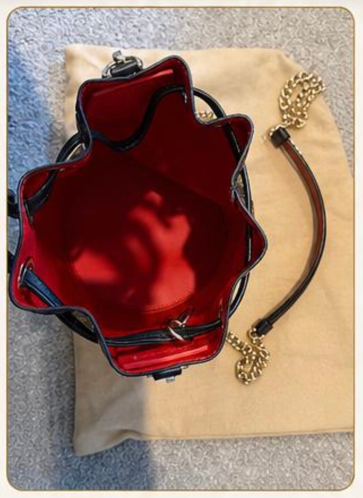 LEOPARD "Bucket Bag - PRELOVED A statement bag that combines Christian Louboutin's signature style with everyday versatility.
